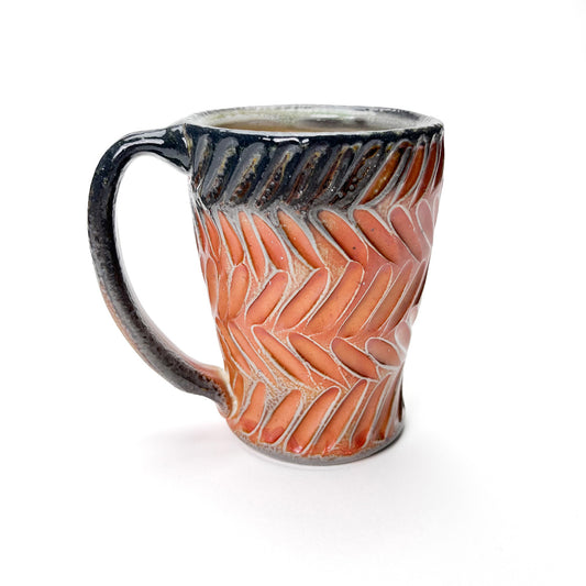 Handmade wheel thrown mug with earth tones