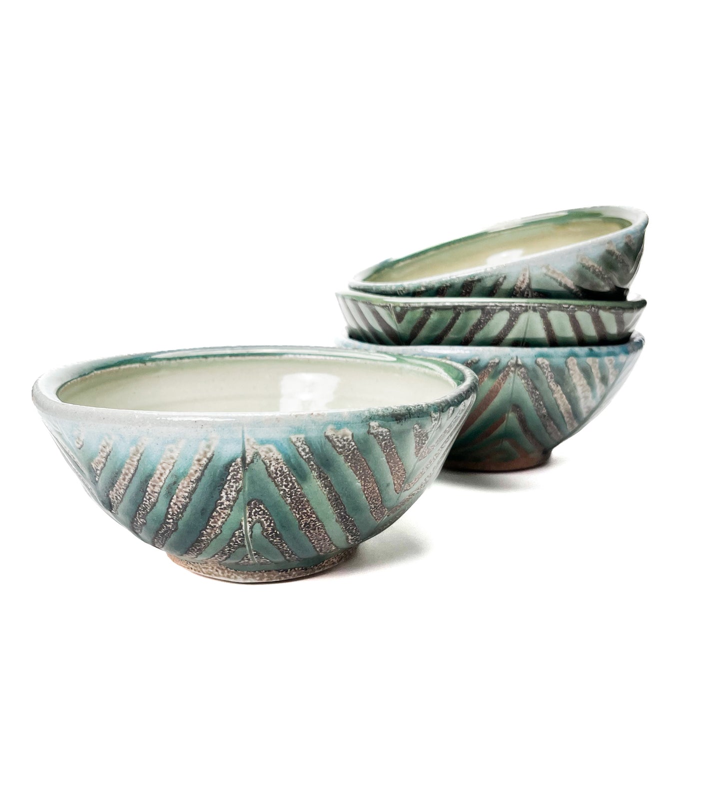 This bowl is a great size for cereal, soup or salad. The hand carved green leaf pattern is inspired by natures and the interior has a white glaze.