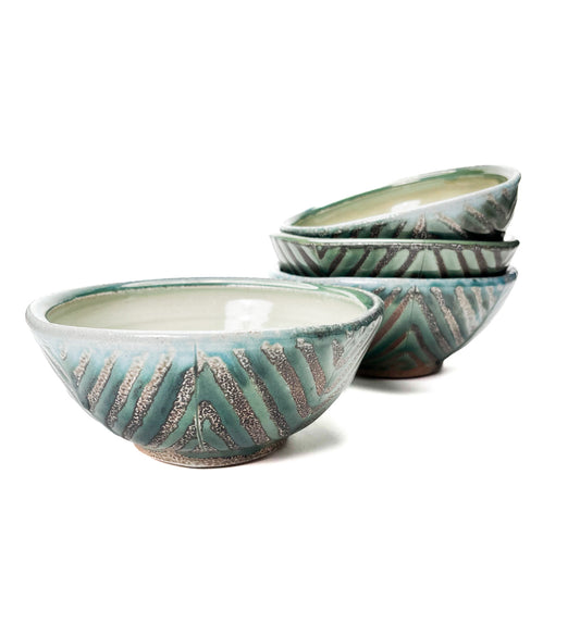 This bowl is a great size for cereal, soup or salad. The hand carved green leaf pattern is inspired by natures and the interior has a white glaze.