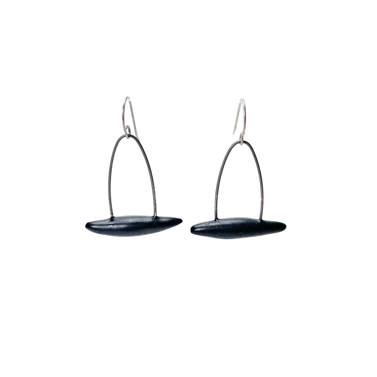 Black handmade earrings that resemble seeds pods. Hypoallergenic ear wires
