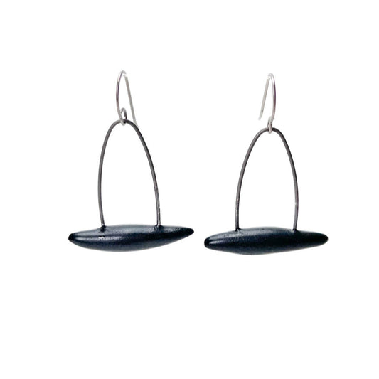 Black handmade earrings that resemble seeds pods. Hypoallergenic ear wires