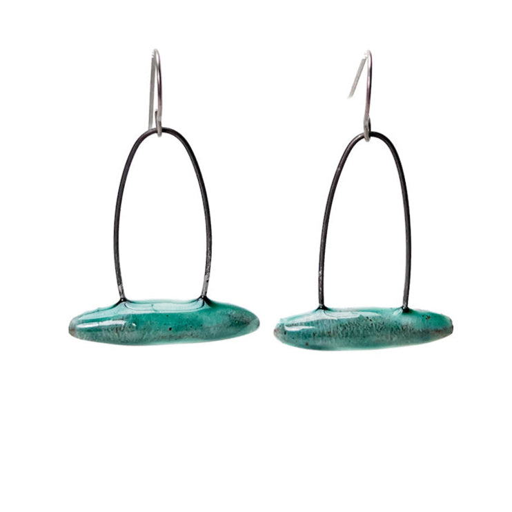 Green handmade earrings that resemble seeds pods. Hypoallergenic ear wires