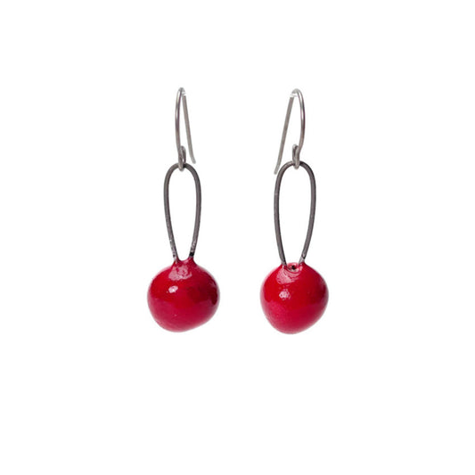 Red handmade earrings that resemble seeds. Hypoallergenic ear wires