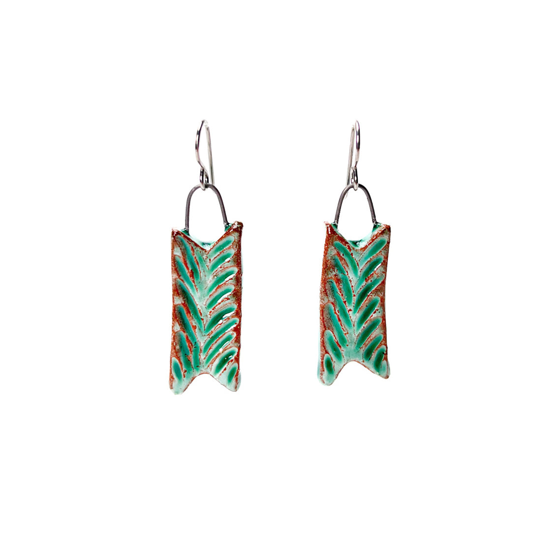 Green handmade earrings carved to look like leaves. Hypoallergenic ear wires