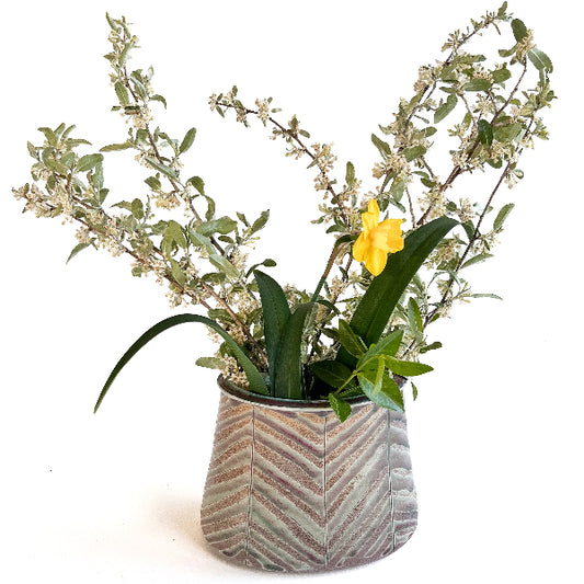 This beautiful oval flower vase has a carved leaf design with greem, purple, red and white mixed tones.