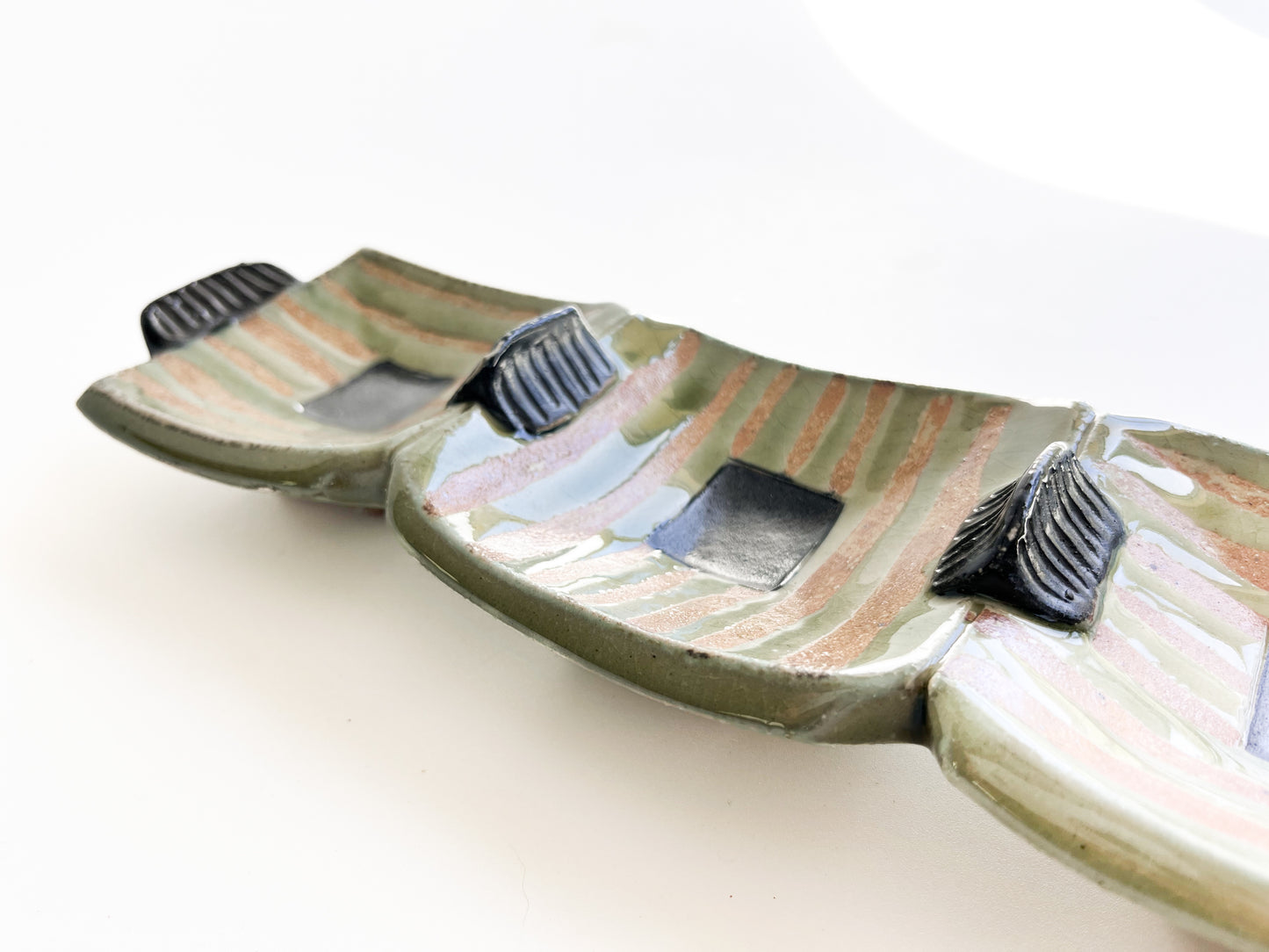 This unique green rectangle tray could be used for serving olives or cheeses, or used as table centerpiece.