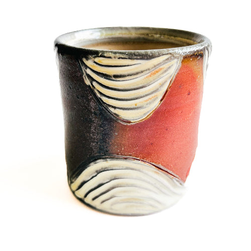 earth toned handmade pottery mug with handcarved texture