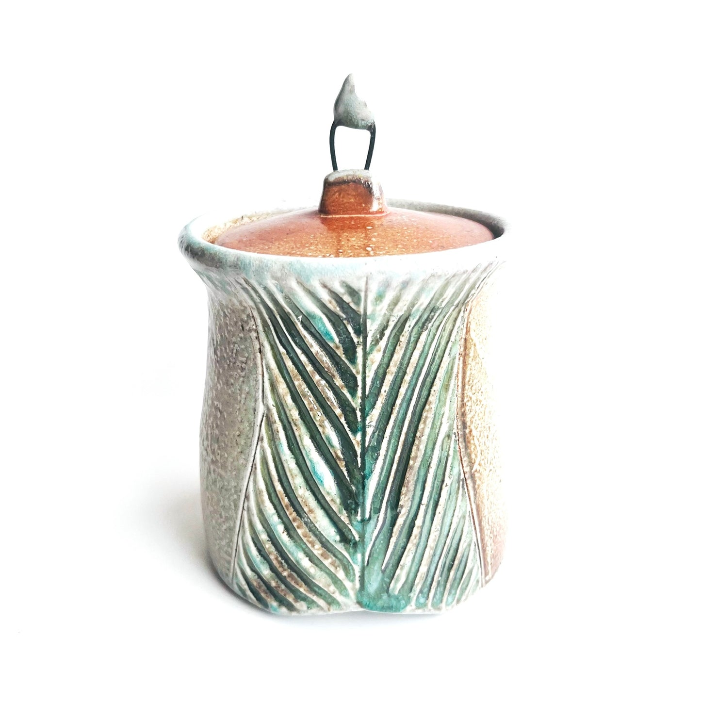 carved jar with wire knob