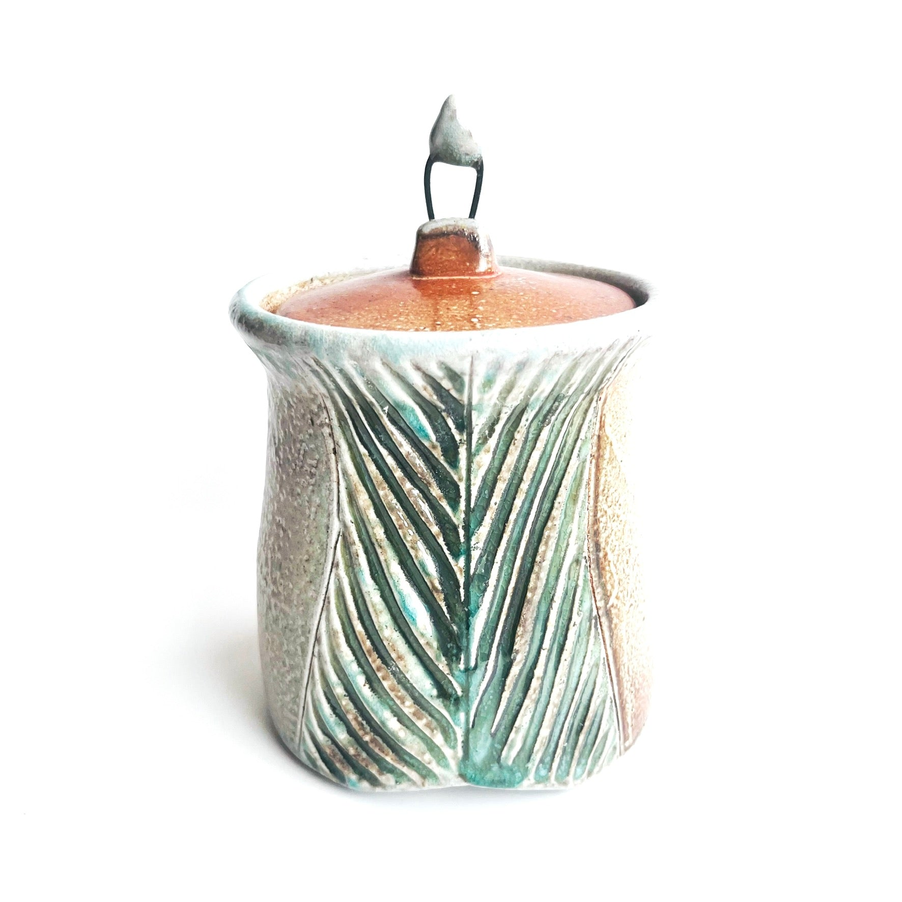 carved jar with wire knob