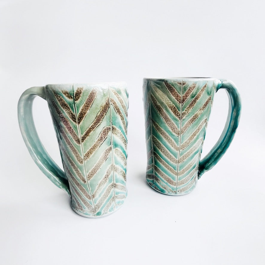 Teal green patterned mug
