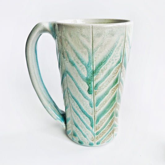 Teal green patterned mug