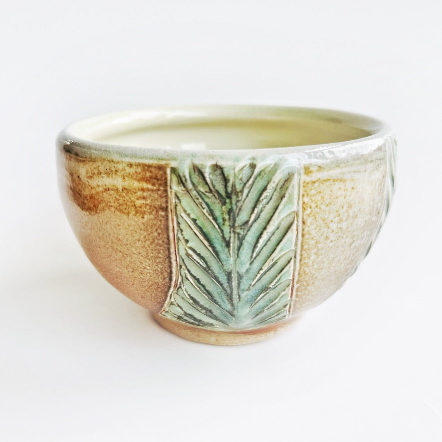 handmade pottery bowls with green carved pattern