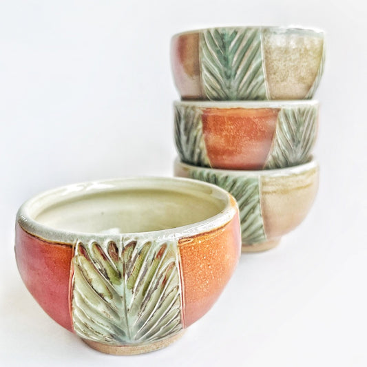 handmade pottery bowls with green carved pattern