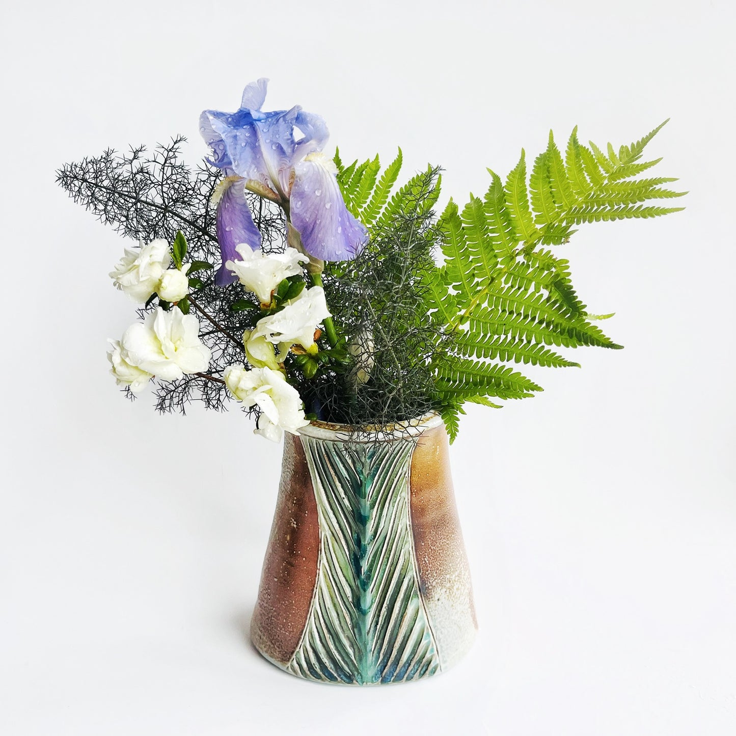 Oval flower vase with flowers displayed