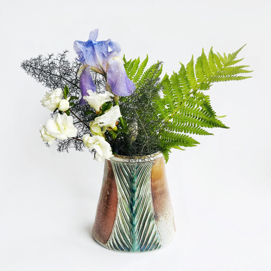 Oval flower vase with flowers displayed