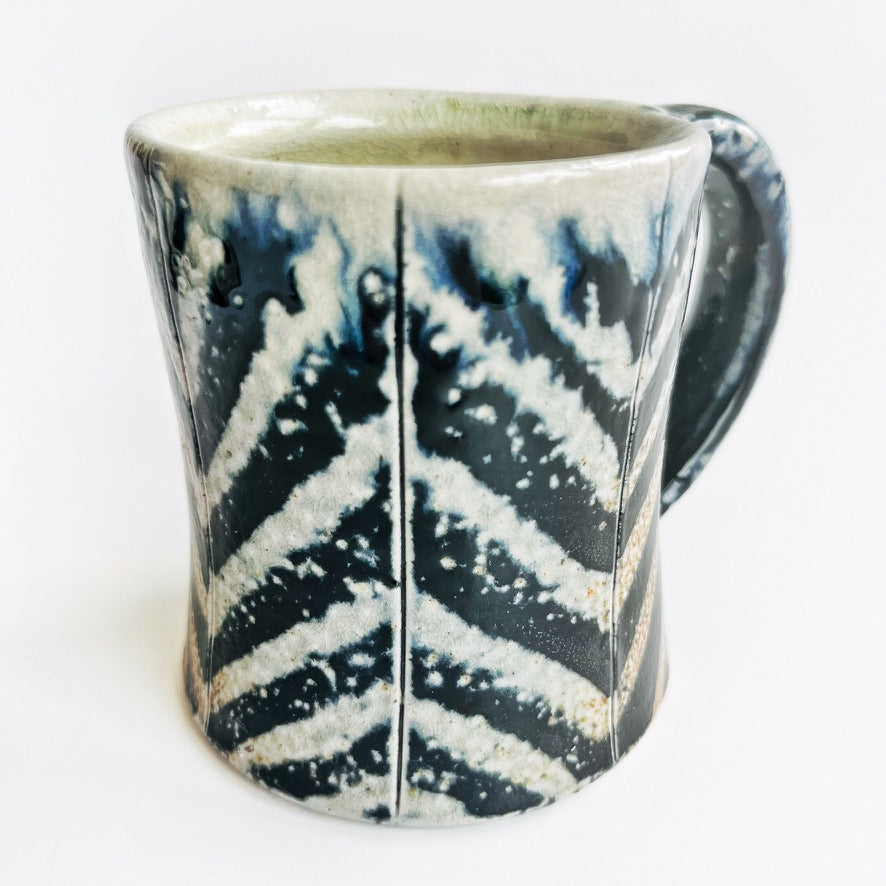 black and white striped pottery mug