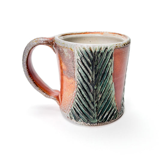Handmade wheel thrown mug, green leaf patterned glaze and earth tones
