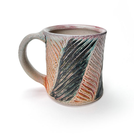 Handmade wheel thrown mug, green leaf patterned glaze and earth tones