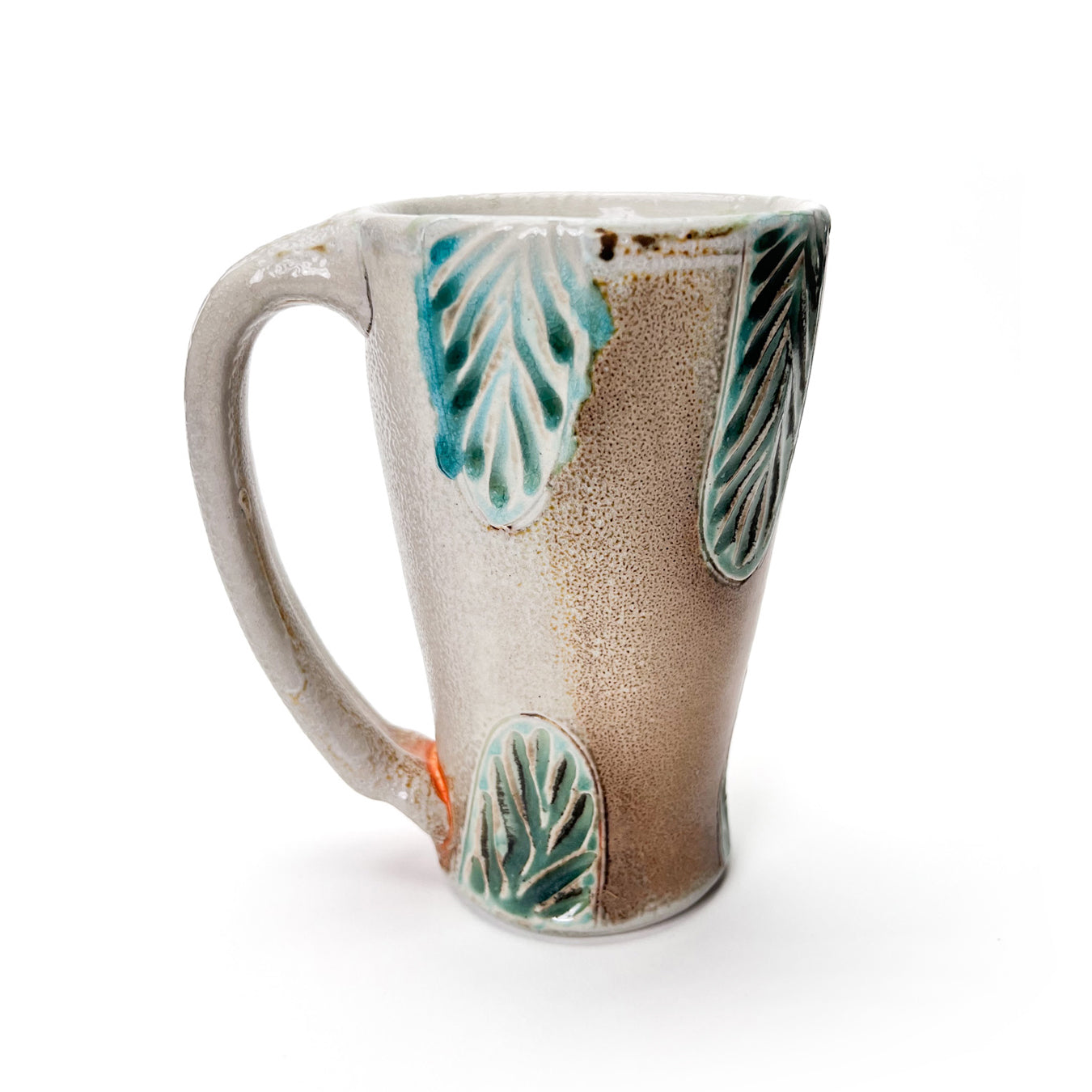 Handmade wheel thrown tall mug, green leaf patterned glaze and earth tones