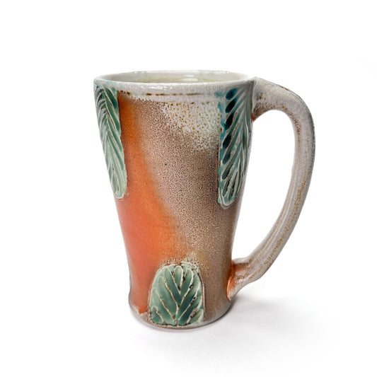 Handmade wheel thrown tall mug, green leaf patterned glaze and earth tones