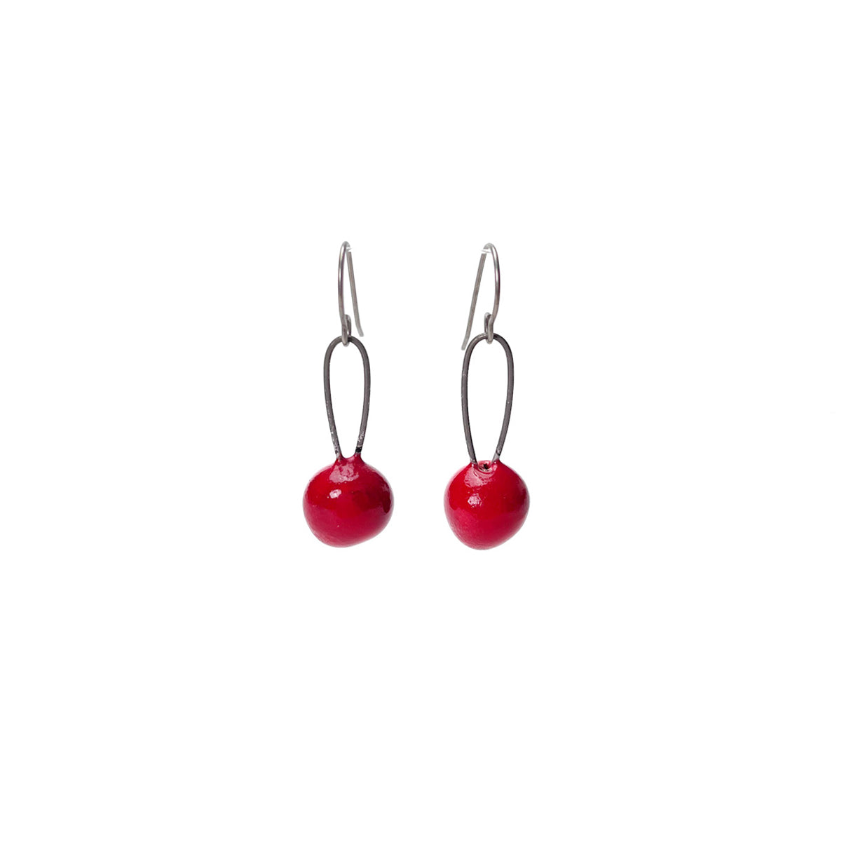 Red handmade earrings that resemble seeds. Hypoallergenic ear wires