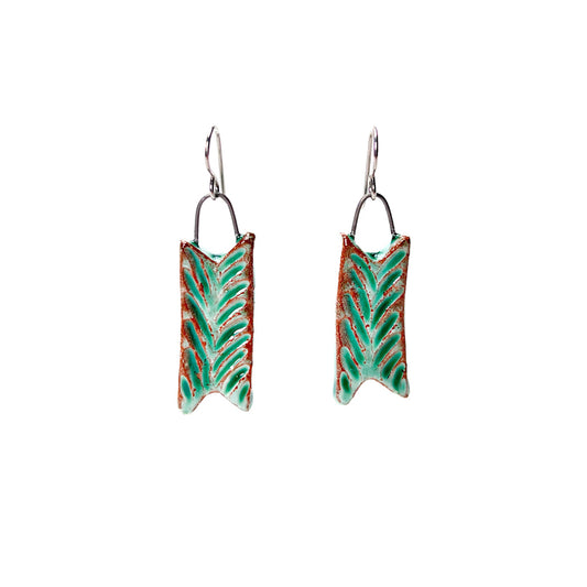 Green handmade earrings carved to look like leaves. Hypoallergenic ear wires