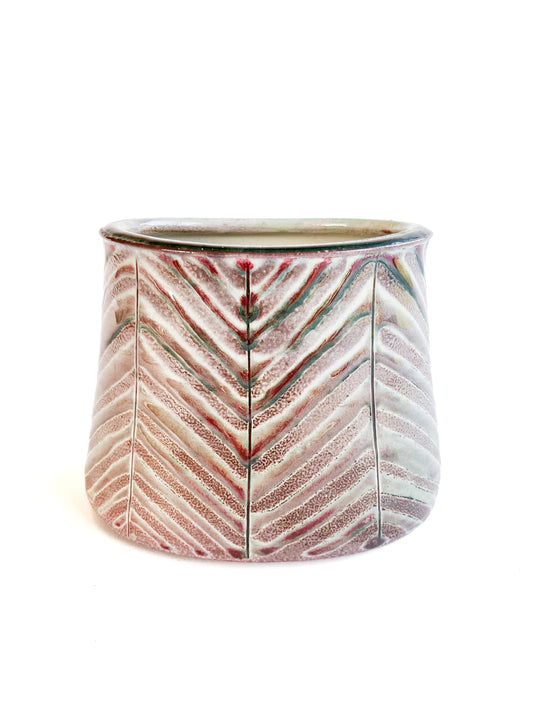 This beautiful oval flower vase has a carved leaf design with greem, purple, red and white mixed tones.