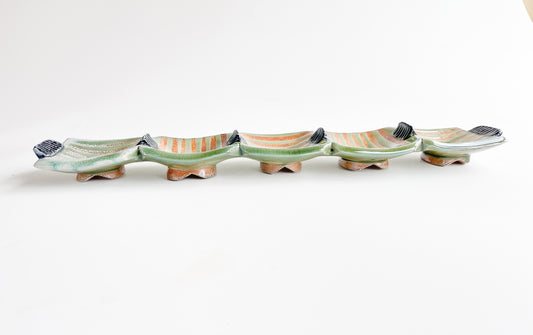 This unique green rectangle tray could be used for serving olives or cheeses, or used as table centerpiece.