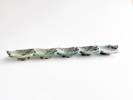This unique green rectangle tray could be used for serving olives or cheeses, or used as table centerpiece.