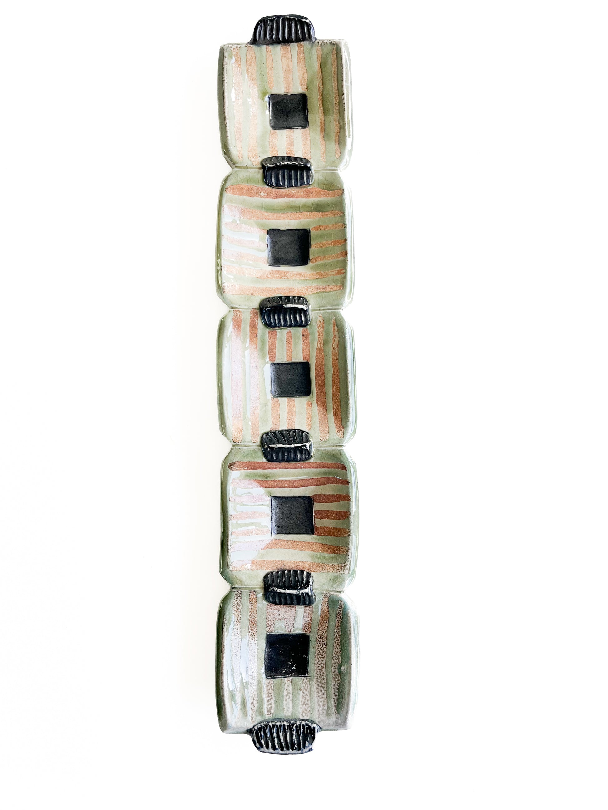 This unique green rectangle tray could be used for serving olives or cheeses, or used as table centerpiece.