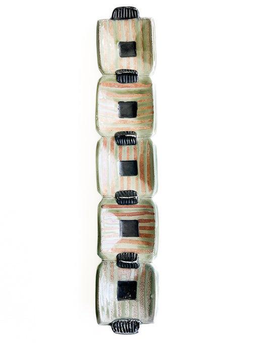 This unique green rectangle tray could be used for serving olives or cheeses, or used as table centerpiece.