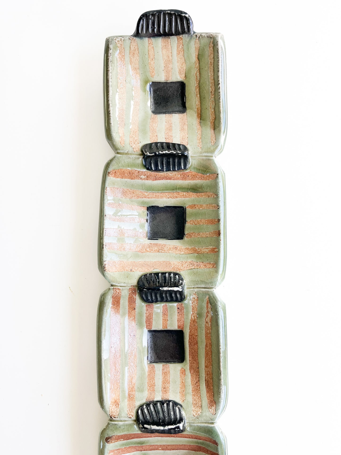 This unique green rectangle tray could be used for serving olives or cheeses, or used as table centerpiece.