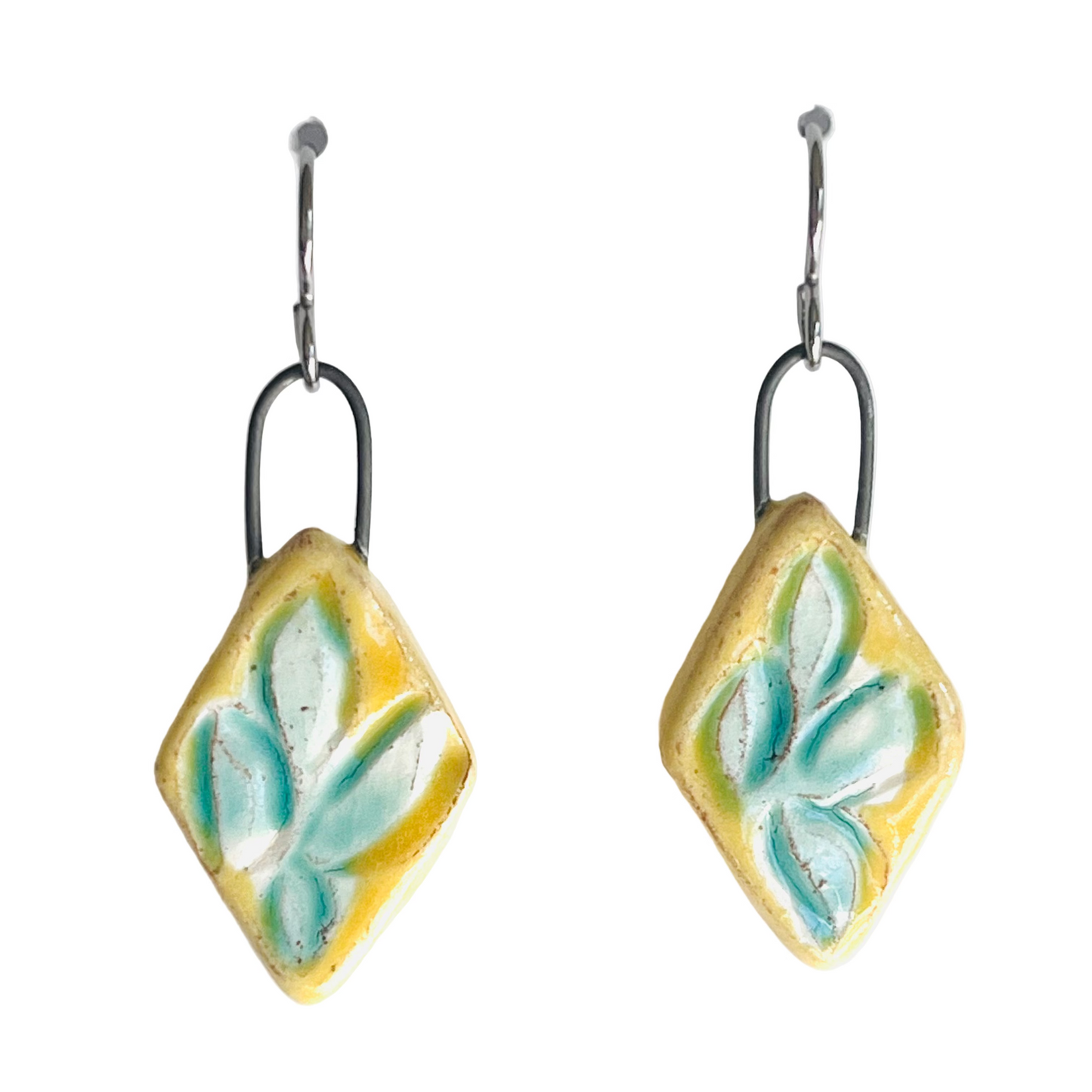 handmade yellow clay earrings with turquoise leaf pattern