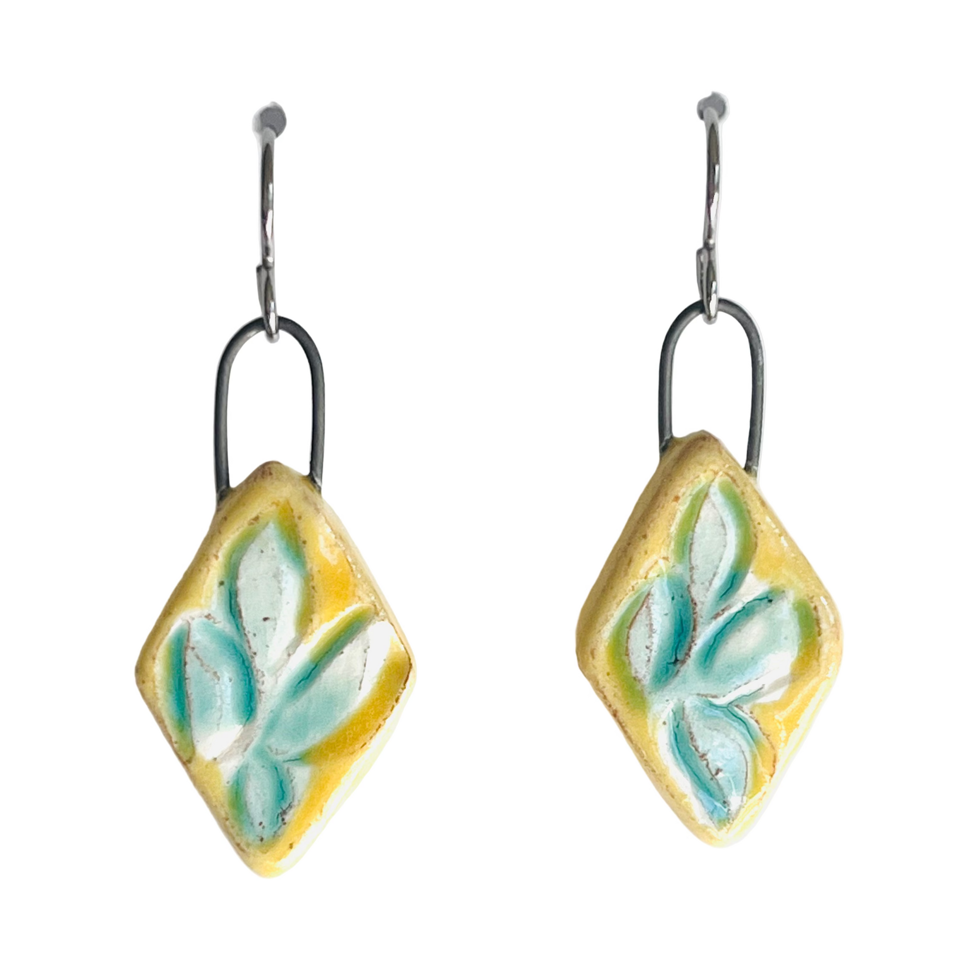 handmade yellow clay earrings with turquoise leaf pattern